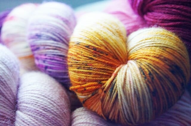 Picture of coils of purple and orange yarn